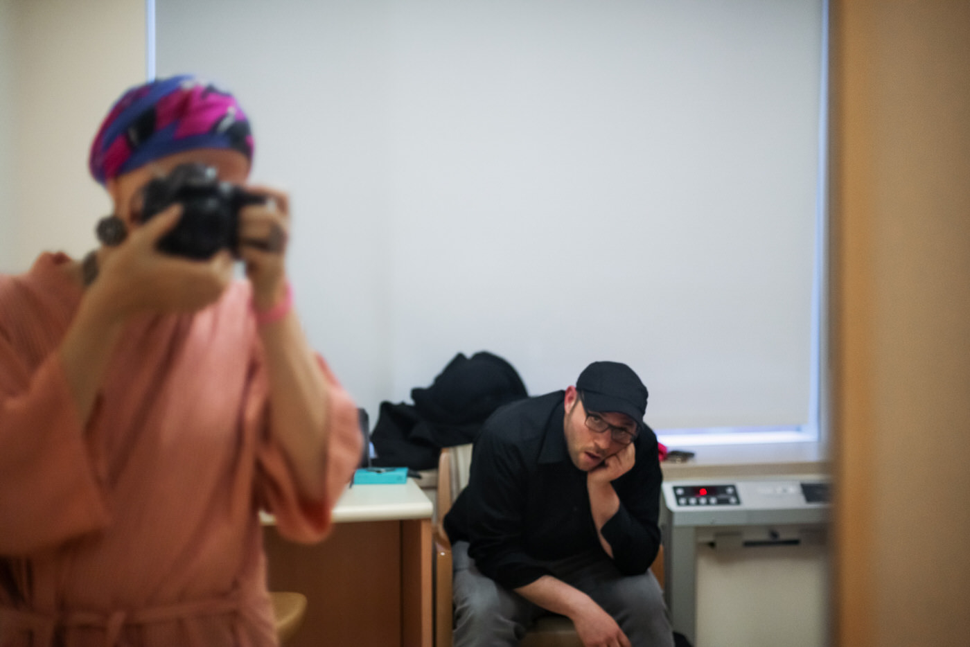 2. anna photo of jordan and her in hospital mirror 80 minutes waiting for the 20 Minute-long consult with a physicianA 80 minutes waiting for the 20 Minute-long consult with a physician. (Photos by Anna and Jordan Rathkopf, 2017/New York City at the hospital Anna was treated)